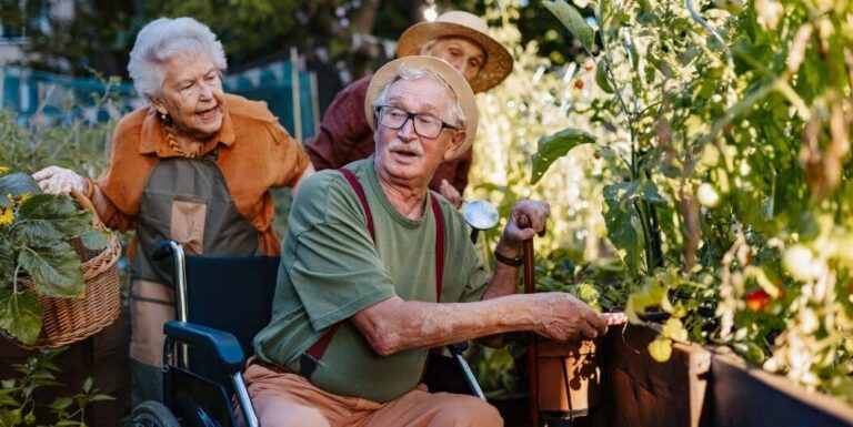 Three Seiors Gardening Outside an Independent Living Facility