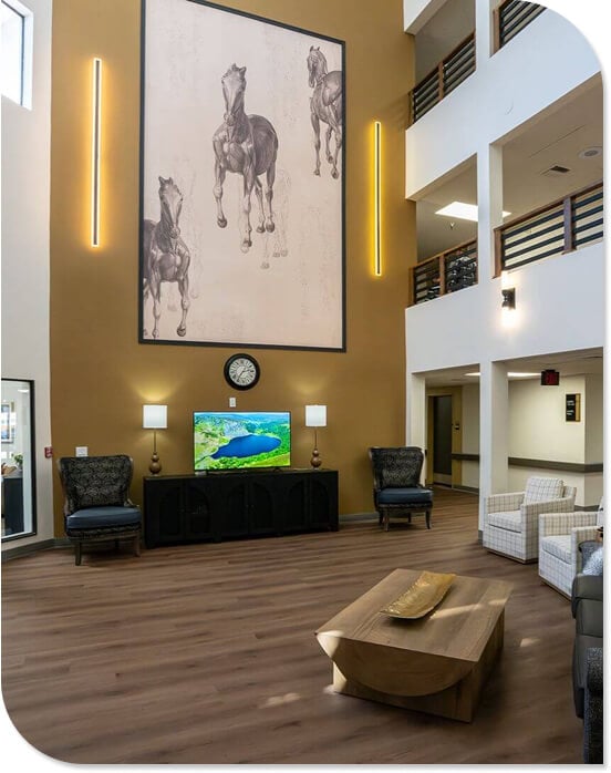 Elegant Lobby with Large Horse Artwork and Lounge Seating at Our Independent Living Facility Elegant Lobby with Large Horse Artwork and Lounge Seating at Our Independent Living Facility